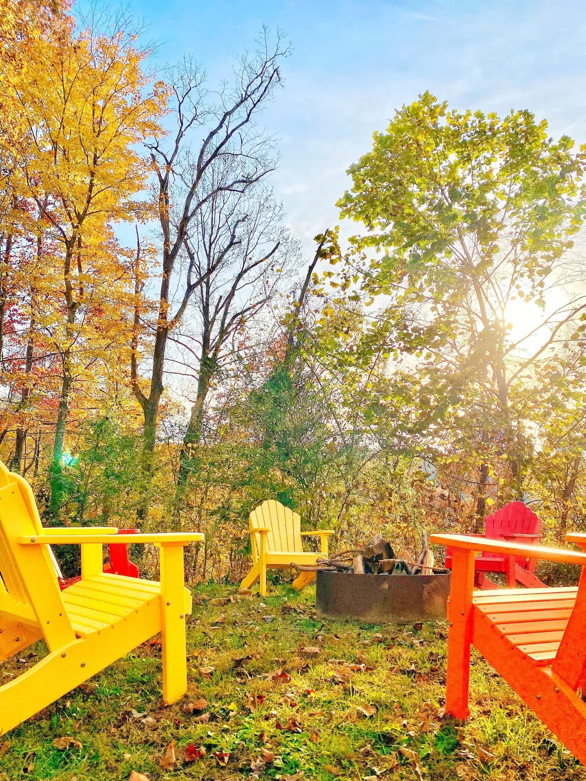 Colorful chairs around fire pit